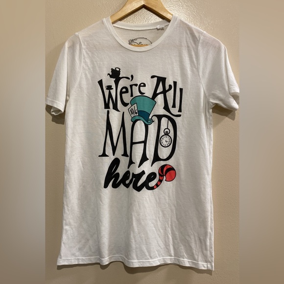 Tops - “We’re All Mad Here” T-shirt